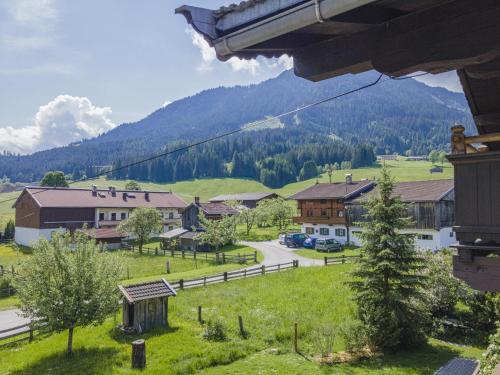 a view of a village with a mountain in the background at Weberhof Top 4 in Brixen im Thale