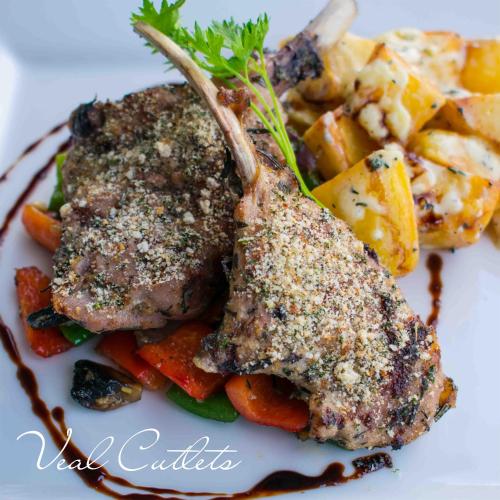 a white plate of food with meat and vegetables at Gateway Hotel in Port Moresby