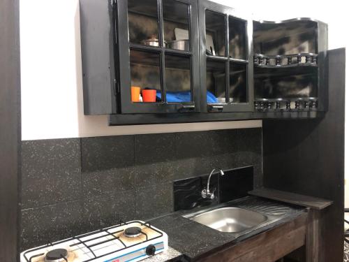 Kuchyň nebo kuchyňský kout v ubytování Hospedaje Maluli 01