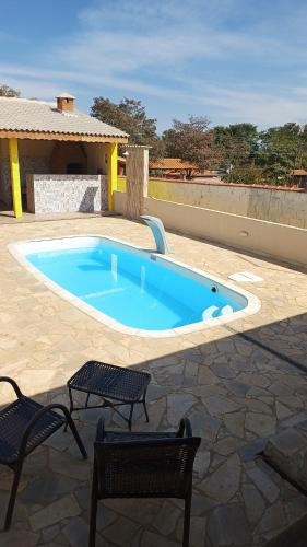 Swimmingpoolen hos eller tæt på Chacara em Salto de Pirapora Condomínio Arco Íris