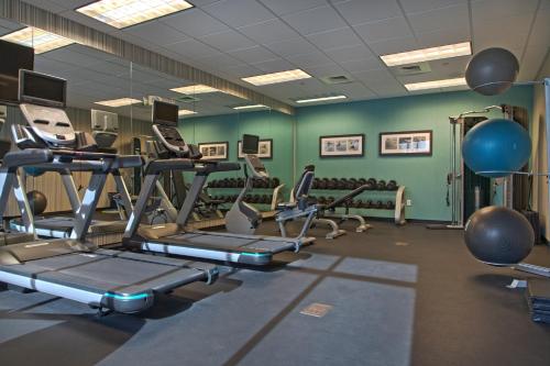 a gym with treadmills and exercise equipment in a room at Holiday Inn Hotel & Suites Northwest San Antonio by IHG in San Antonio