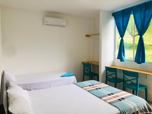 Postel nebo postele na pokoji v ubytování EL JARDIN OLON SUITES