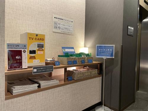 a counter in a store with boxes on it at Hotel Route-Inn Saku Minami Inter in Saku