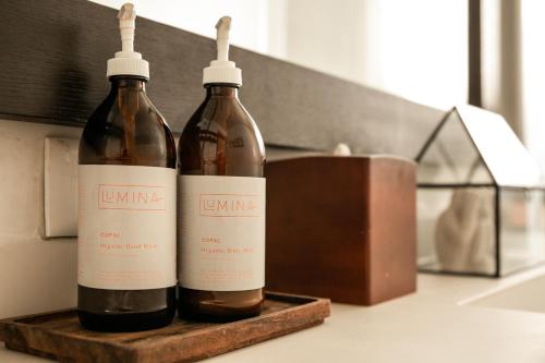 two bottles of wine sitting on a counter at Lumina at Looltum Tulum in Tulum