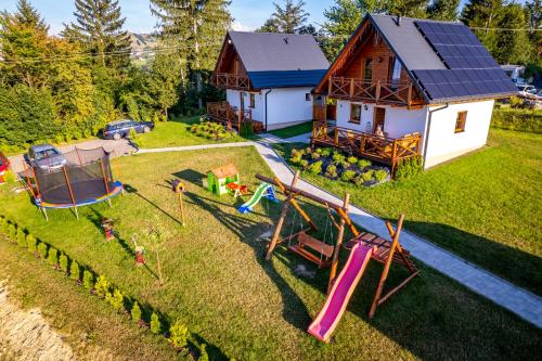 an aerial view of a house with a playground at Domki na Beskidzie 1861 in Istebna