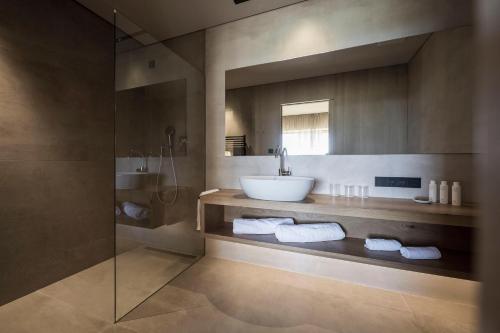a bathroom with a sink and a shower at ADLER Spa Resort SICILIA in Siculiana