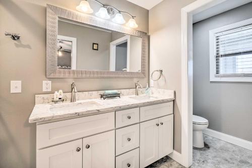 a bathroom with a sink and a mirror at Spring City Home Lakefront Boating Getaway! in Spring City