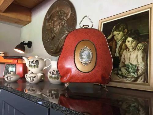 a table with a red object on top of a counter at Landgoed Versteegh nabij heerlijkheid Mariënwaerdt in Beesd