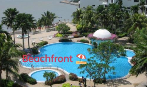 an overhead view of a pool at a beachfront resort at CosY Klebang Homestay in Kampong Lereh