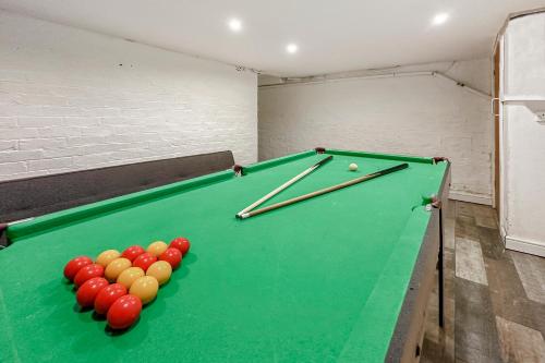 a room with a pool table with balls on it at Central House with Pool Table, Free Parking, Super-Fast Wifi and Smart TV with Virgin TV and Netflix by Yoko Property in Northampton