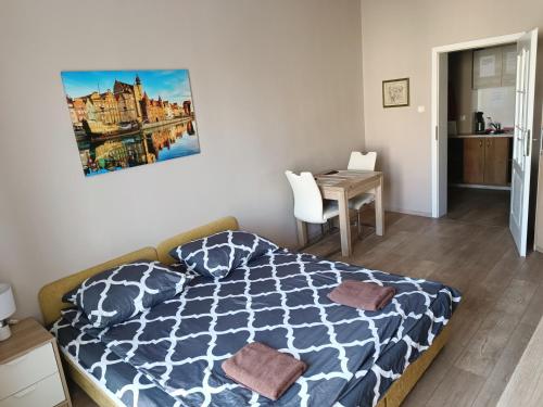 Posteľ alebo postele v izbe v ubytovaní Bon Voyage Kawalerka