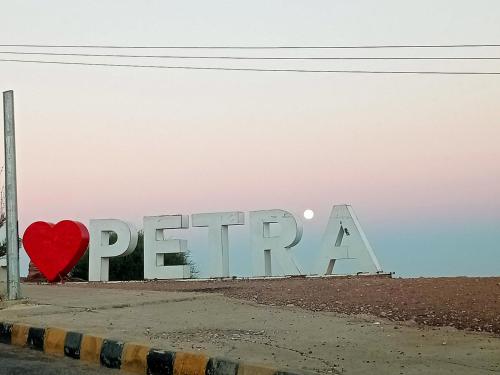 a sign that says persevere with a red heart at Basant Villa in Wadi Musa