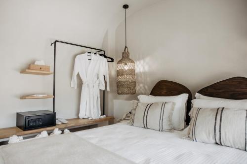 a bedroom with a bed and a mirror at Casa Cabana Boutique Hotel & Spa - Adults Only in Faliraki