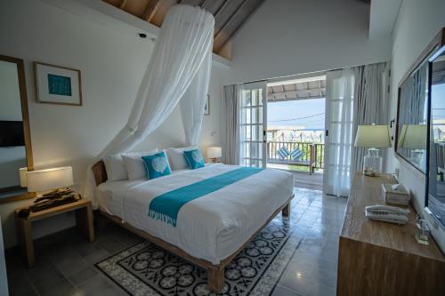 Un ou plusieurs lits dans un hébergement de l'établissement Kardia Resort Gili Trawangan A Pramana Experience