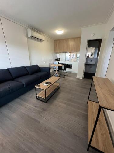 a living room with a couch and a table at The Sea Pavilions in Cowes
