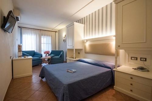 Postel nebo postele na pokoji v ubytování Hotel Barsalini