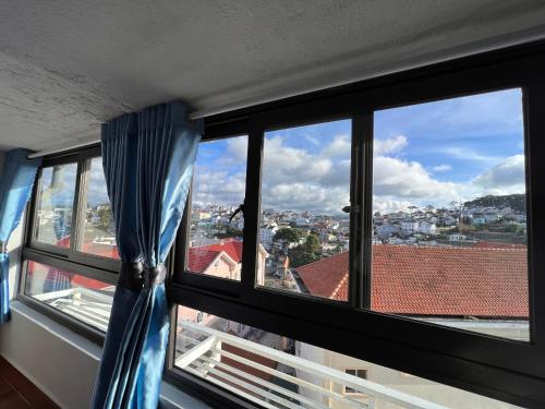 a view of a city from a window at Cơ sở lưu trú du lịch Uyên Thanh 2 in Da Lat