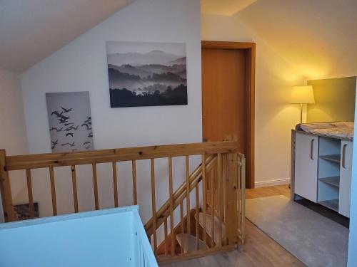 a room with a wooden staircase and a stair case at Familienfreundliche Ferienwohnung Soltau in Soltau