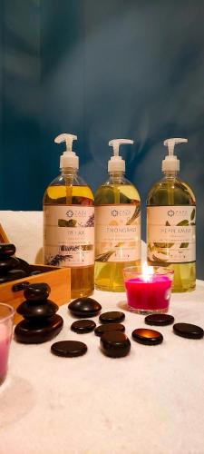 a group of bottles of soap and cookies on a table at HOTEL ROYAL MOUNTAIN in Divčibare