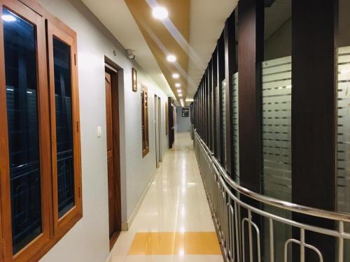 a corridor of a building with at MP RESIDANCY in Perintalmanna