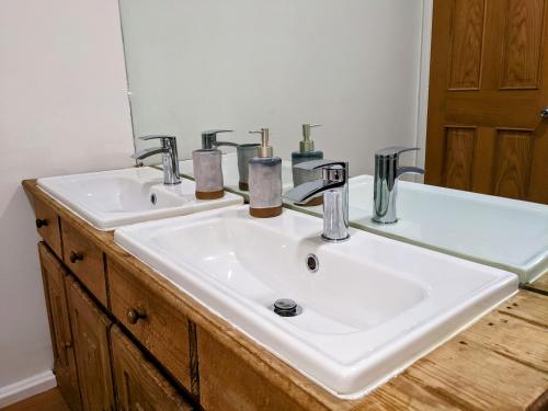 a bathroom with a white sink and a mirror at The Cranny, Portstewart in Portstewart