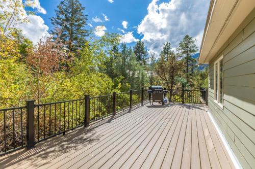 a deck with a fence and a grill on it at 177 Blue Tip Drive in Ridgway