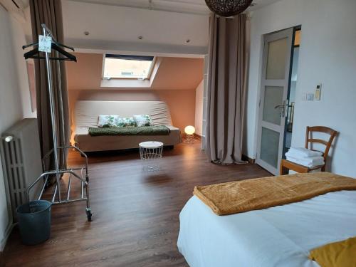En eller flere senge i et værelse på La maison d'adèle