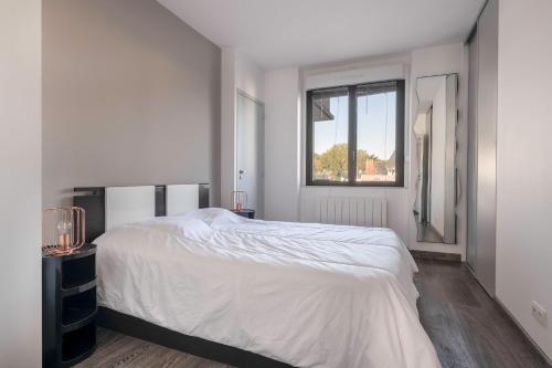 Katil atau katil-katil dalam bilik di Plage du Nau, vue mer, bel appartement pour 6