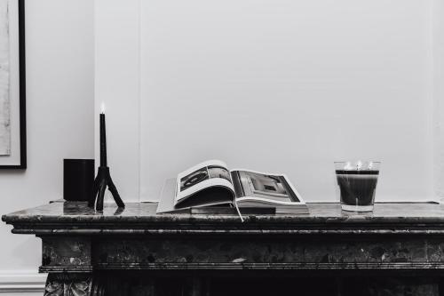 a table with a phone on top of it at LuxuryApartmentSoulforCity in Ghent