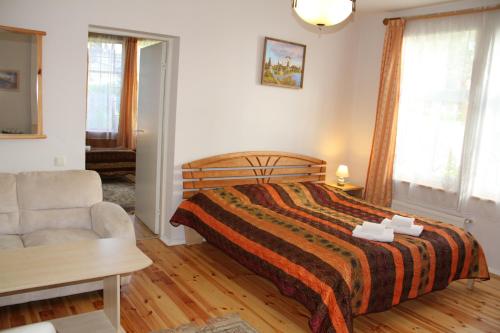 Postel nebo postele na pokoji v ubytování Sunset Hotel