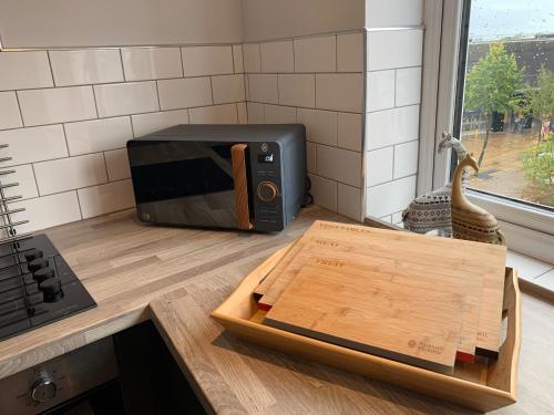 a microwave oven sitting on top of a kitchen counter at The Upper Gathering - Sleeps Up To 9 in Sale