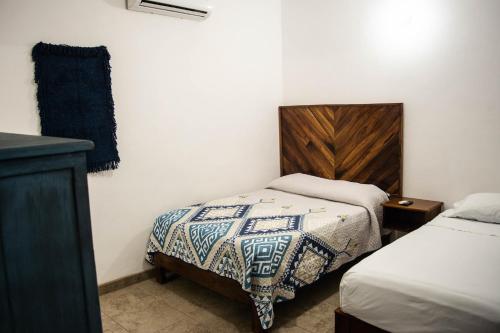 DownTown Rooms San Pancho Mexicoにあるベッド