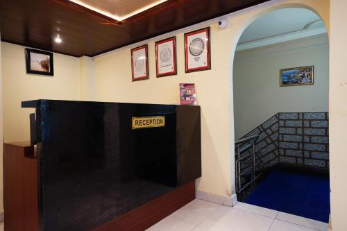 a room with a sign that says restart on the wall at Hotel White Lotus Gangtok in Gangtok