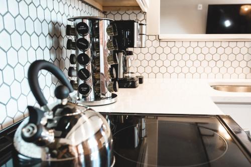 a kitchen with a coffee pot on a counter at Three Trails in Elkin