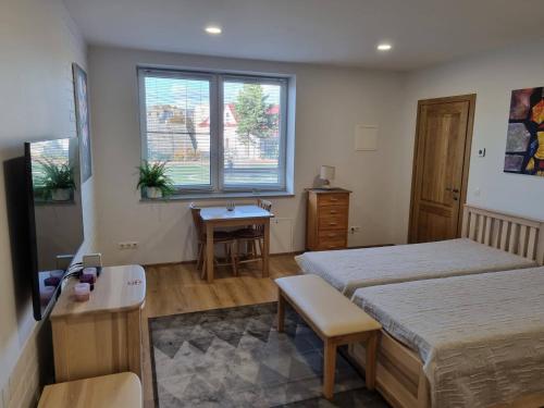 Postel nebo postele na pokoji v ubytování Neris apartments
