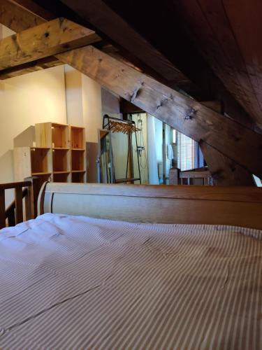 a bedroom with a white bed in a attic at Spacious Ski Chalet In Traditional French Village, sleeps 8, Four Star with fibre broadband in Abondance
