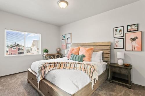 a bedroom with a large bed and a window at Brand New 2 Bed 2 Bath Near Perry District and DT in Spokane