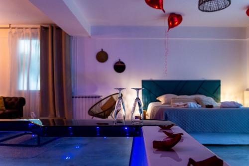 a room with a table and a bed with balloons at Suite and Spa 21 in Dijon