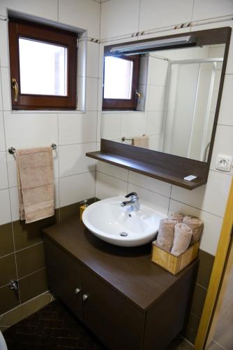 a bathroom with a sink and a mirror at Holiday home Maša - Kupres in Kupres