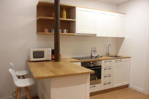 Kuchyň nebo kuchyňský kout v ubytování Apartamentos CAN GUSI