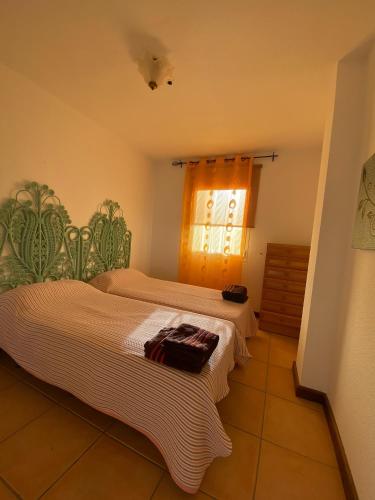 Postel nebo postele na pokoji v ubytování By The Sea Apartment Corralejo