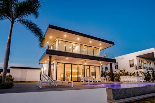a house with a pool in front of it at Ocean view luxury Villa, Private Pool 4BD 8PPL in Playa Venao