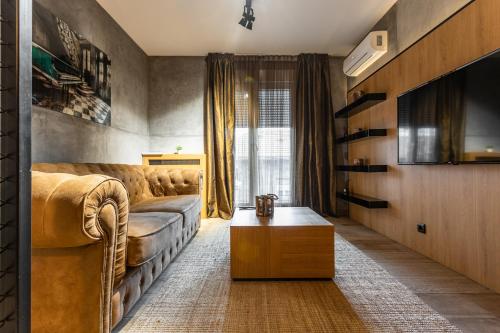 a living room with a couch and a table at Bella Roe Premium Apartments in Belgrade
