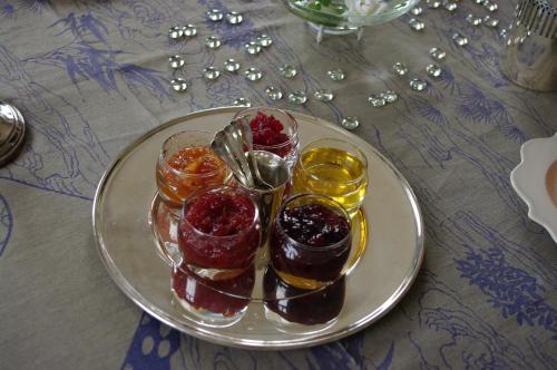 a plate with four different types of desserts on a table at Château de Pommeuse in Pommeuse