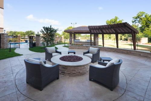 a patio with a table and chairs and a gazebo at Staybridge Suites Charlottesville Airport by IHG in Charlottesville