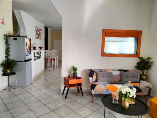 a living room with a couch and a table at Apartments & rooms Saša in Podčetrtek