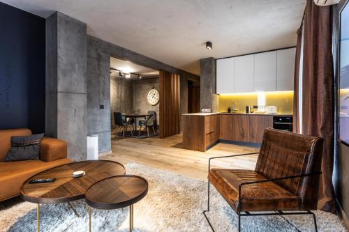 a living room with a couch and a table at Bella Roe Premium Apartments in Belgrade