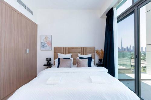 Postel nebo postele na pokoji v ubytování Burj Khalifa View 1 Bedroom - Pool & Gym