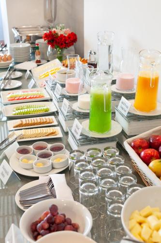 a buffet of different types of food on a table at Muru Homely Hotel Cusco in Cusco