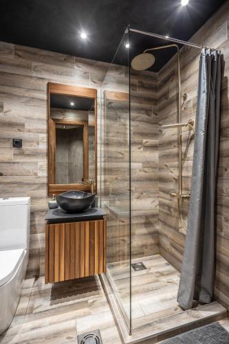 a bathroom with a sink and a shower at Bella Roe Premium Apartments in Belgrade